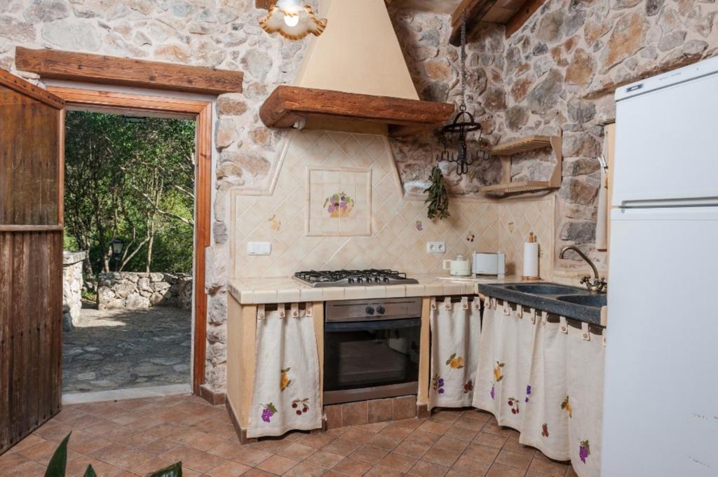 Kuchyň nebo kuchyňský kout v ubytování Casa De Piedra
