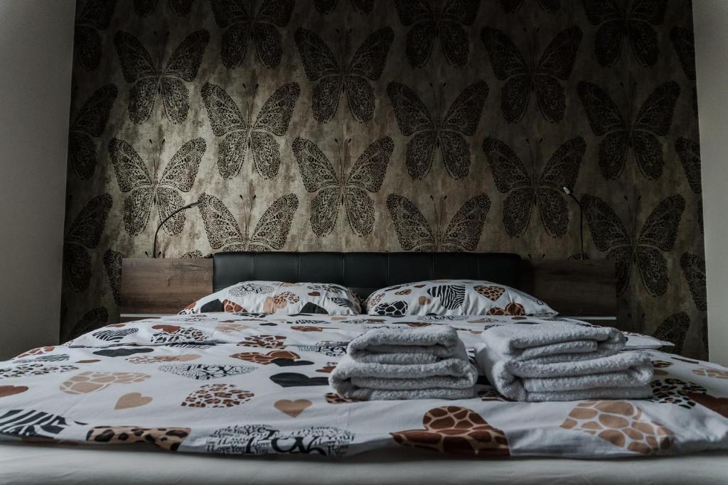 Postel nebo postele na pokoji v ubytování Apartamenty Tychy Barona