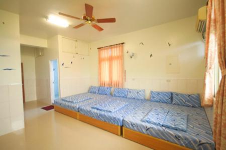 Postel nebo postele na pokoji v ubytování HaiAn Xian Homestay