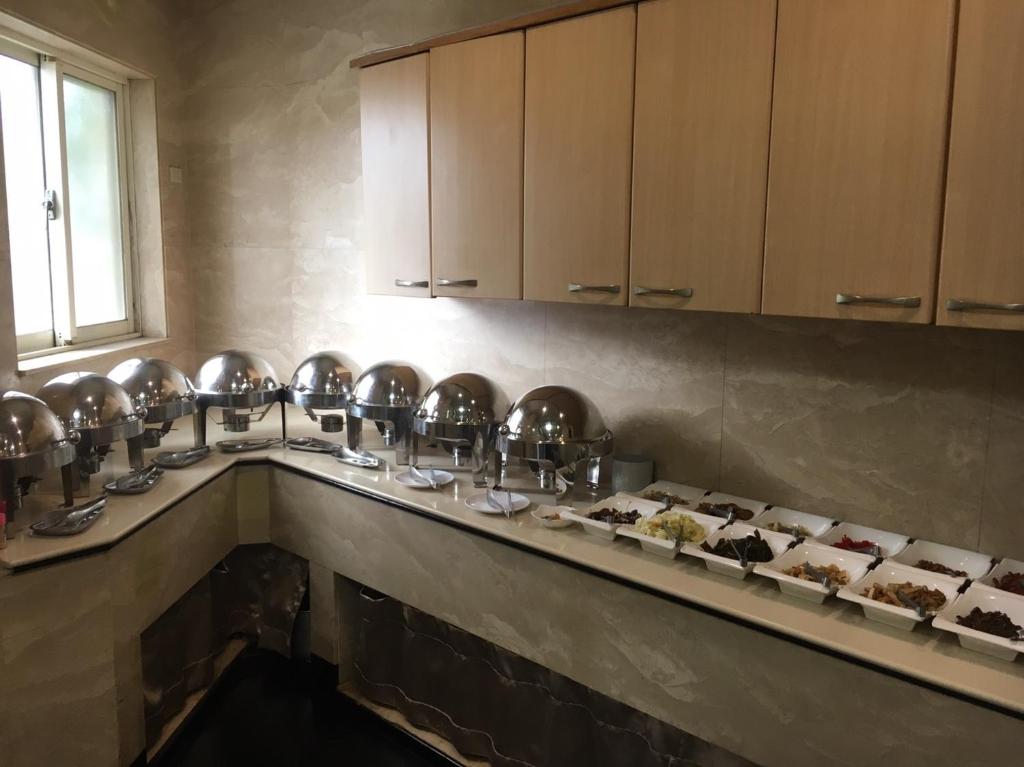 a row of plates of food on a counter at Hua Tai Hotel in Hsinchu City