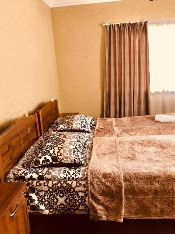 Postel nebo postele na pokoji v ubytování Guesthouse Chela