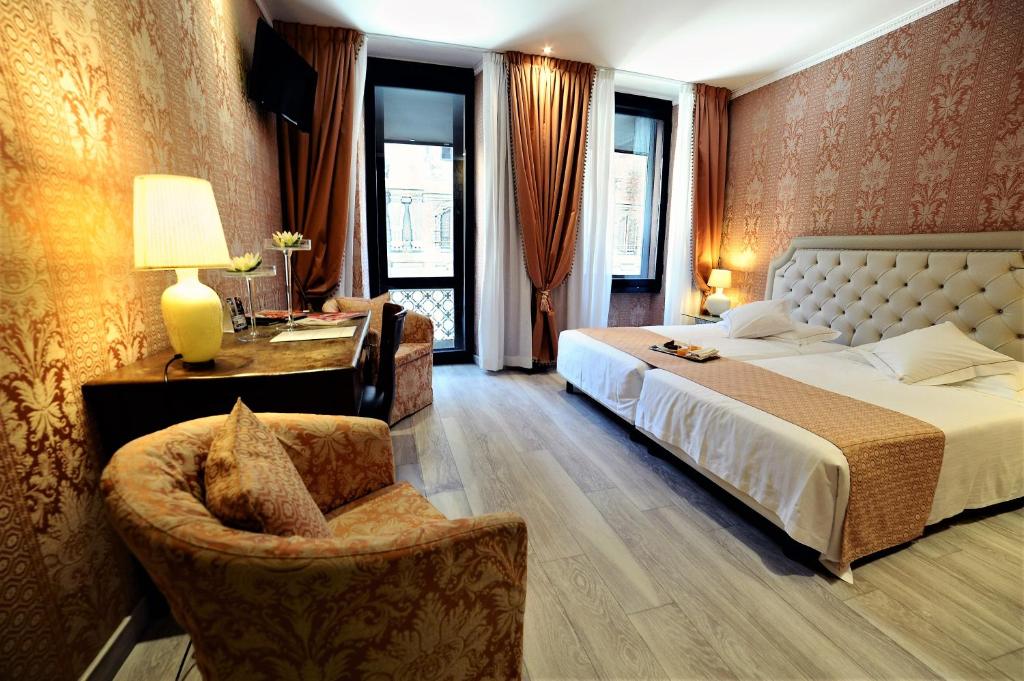 Postel nebo postele na pokoji v ubytování Hotel Pierre Milano