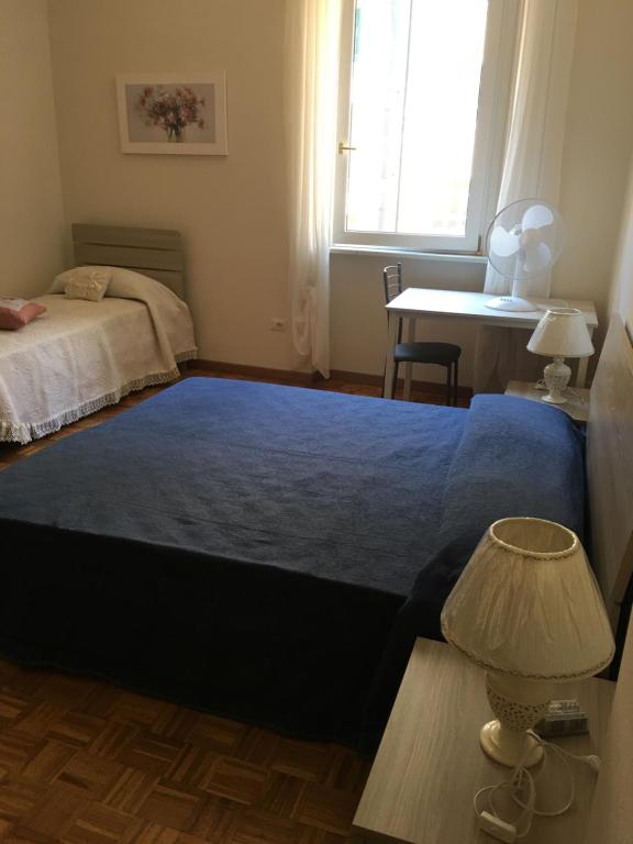 Łóżko lub łóżka w pokoju w obiekcie Appartamento - Casa vacanza Nonna Grazia