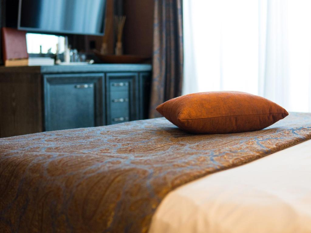 Postel nebo postele na pokoji v ubytování Hotel Forza Mare
