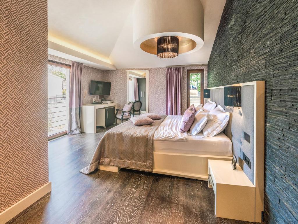 Postel nebo postele na pokoji v ubytování Hotel Forza Mare
