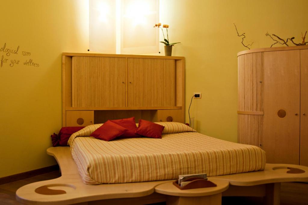 Postel nebo postele na pokoji v ubytování eco Hotel Milano & BioRiso Restaurant