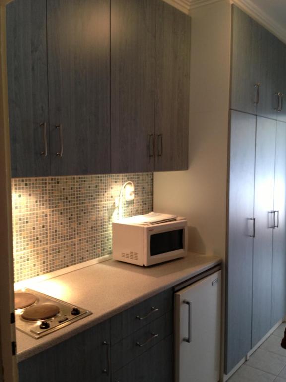 Kuchyň nebo kuchyňský kout v ubytování Kosztolányi Apartmanház
