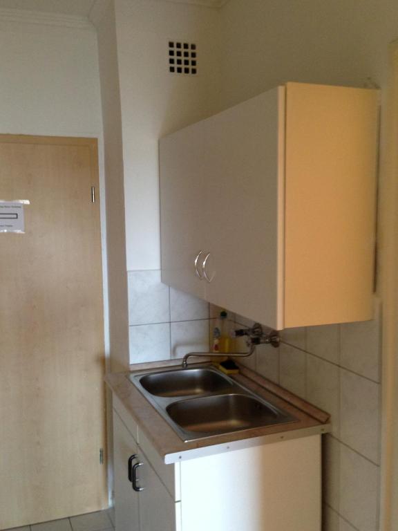 Kuchyň nebo kuchyňský kout v ubytování Kosztolányi Apartmanház
