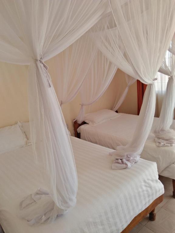 Postel nebo postele na pokoji v ubytování Bomen Hotel