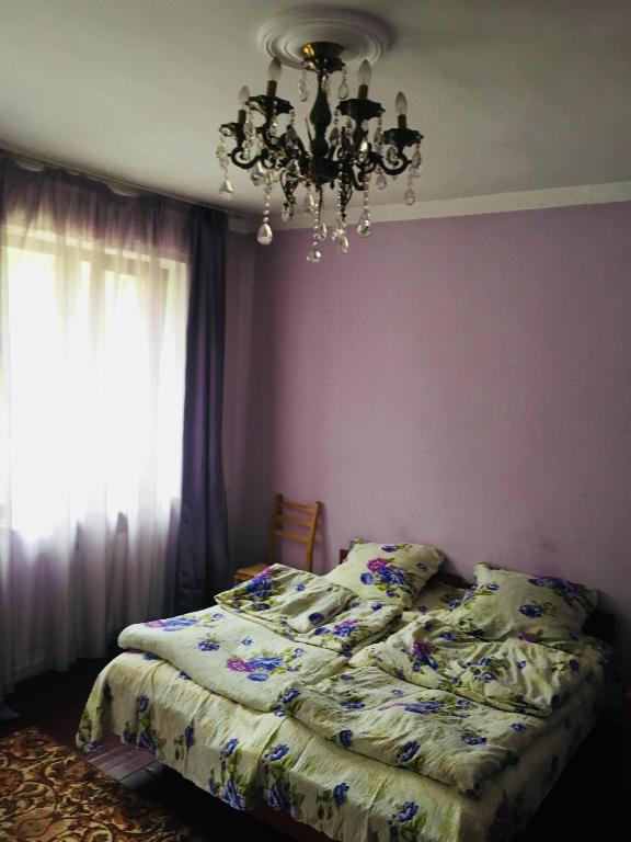 Postel nebo postele na pokoji v ubytování Maia's Guest House Gergeti