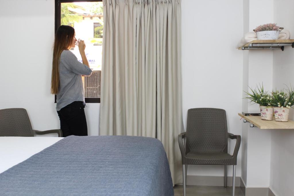 Postel nebo postele na pokoji v ubytování Hotel Boutique Plaza