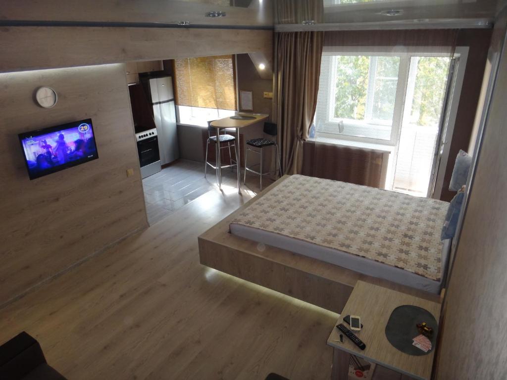 A bed or beds in a room at Васильева 1