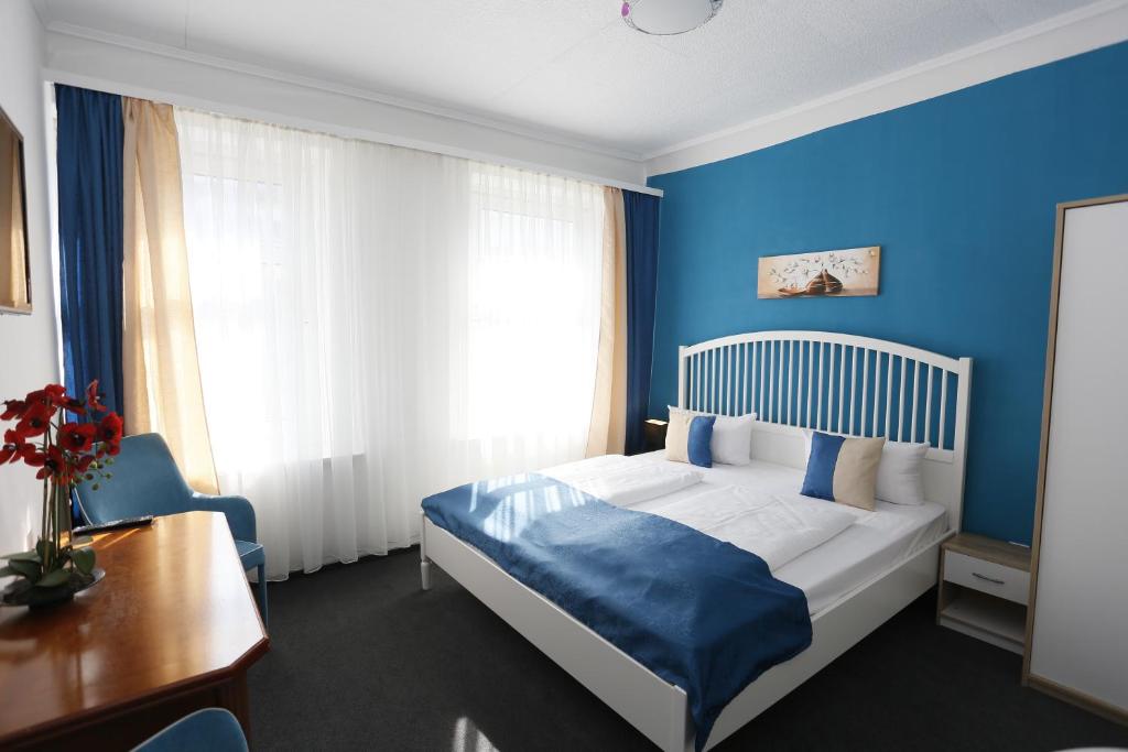 Postel nebo postele na pokoji v ubytování Hotel Condor