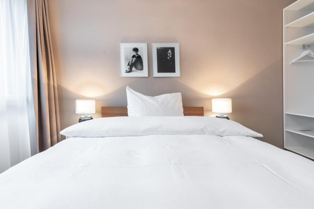 Postel nebo postele na pokoji v ubytování Hotel Birsighof Basel City Center