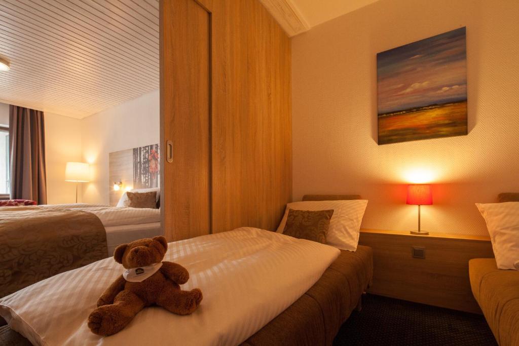 Postel nebo postele na pokoji v ubytování Best Western Plus Schwarzwald Residenz