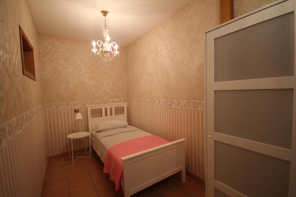 Postel nebo postele na pokoji v ubytování B&b Cortile Aurora
