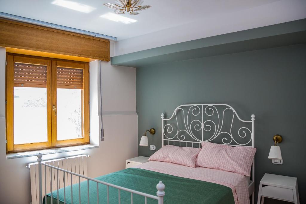 Postel nebo postele na pokoji v ubytování B&b Cortile Aurora