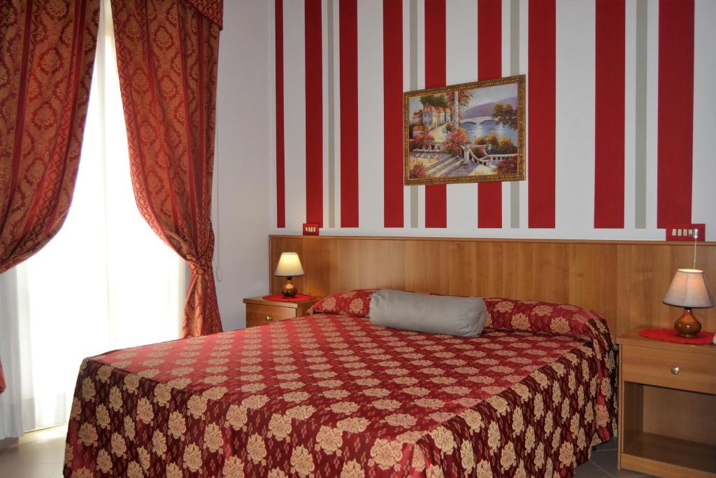 Postel nebo postele na pokoji v ubytování Hotel Facioni