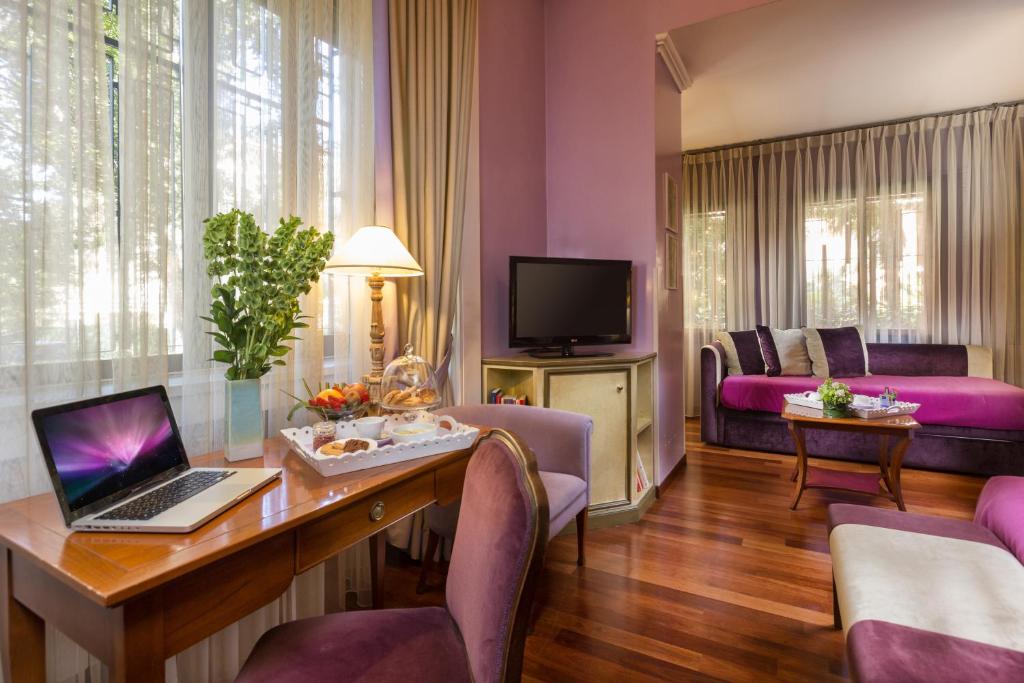 TV a/nebo společenská místnost v ubytování Hotel Fenix