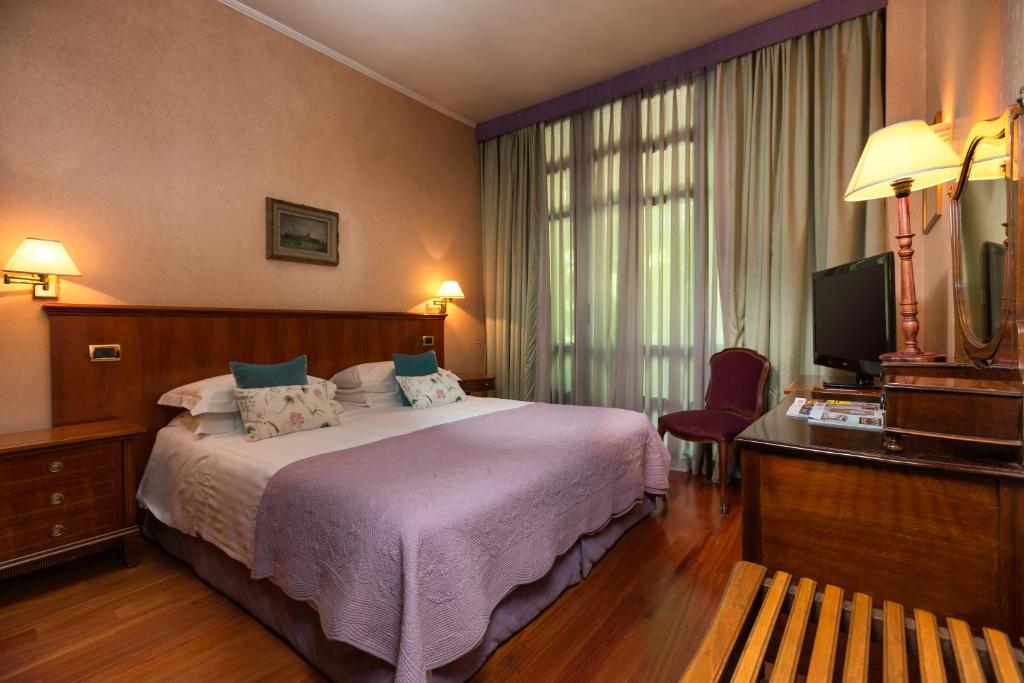Postel nebo postele na pokoji v ubytování Hotel Fenix