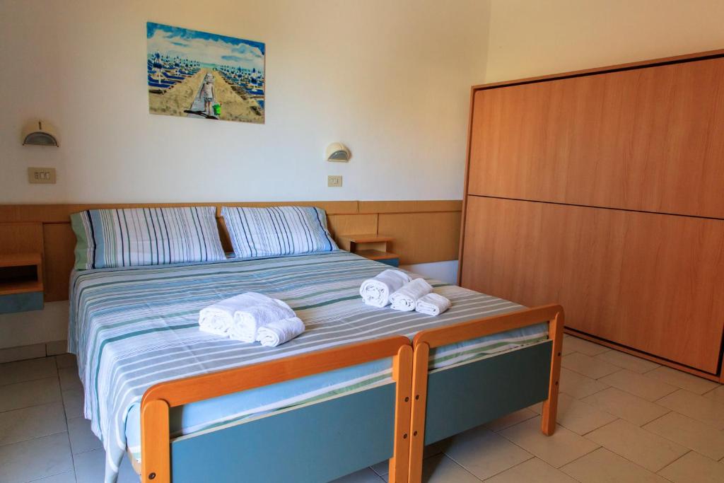 Postel nebo postele na pokoji v ubytování Hotel Riziana