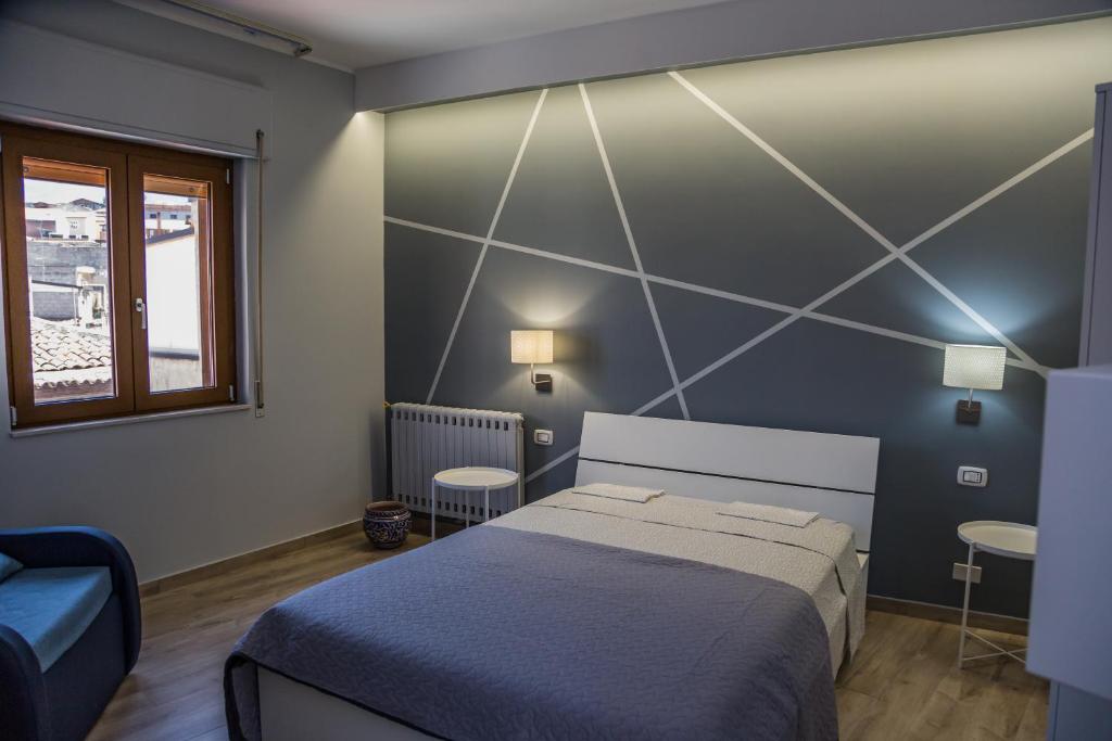 Postel nebo postele na pokoji v ubytování B&b Cortile Aurora