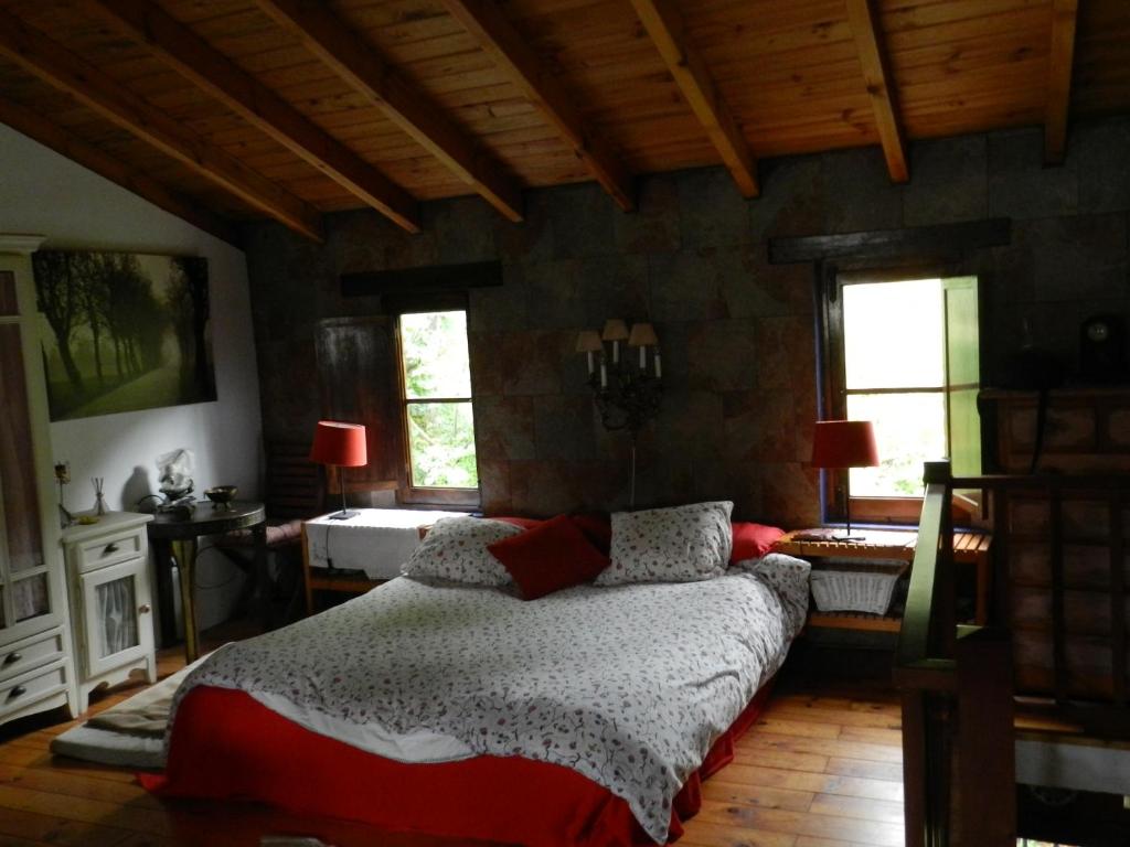 Tempat tidur dalam kamar di La Casa de Gaia