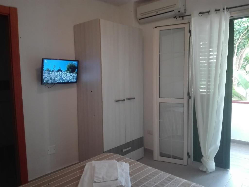 Łóżko lub łóżka w pokoju w obiekcie Appartamenti Tropea Gargano