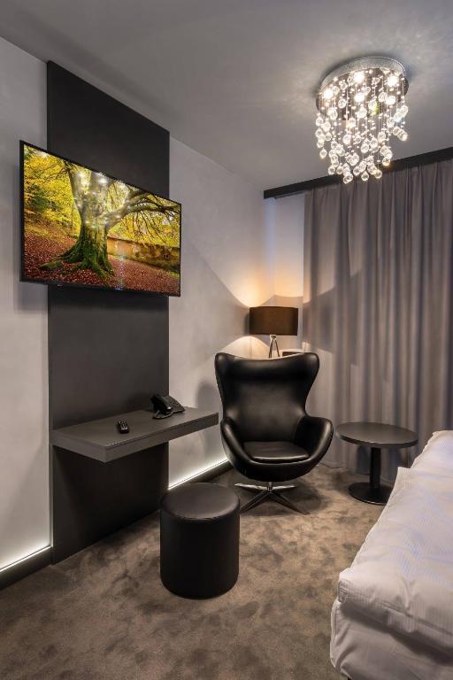 Postel nebo postele na pokoji v ubytování Hotel Grand