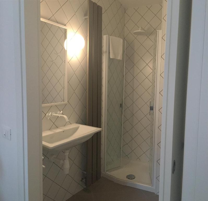 A bathroom at San Marco Design Suites