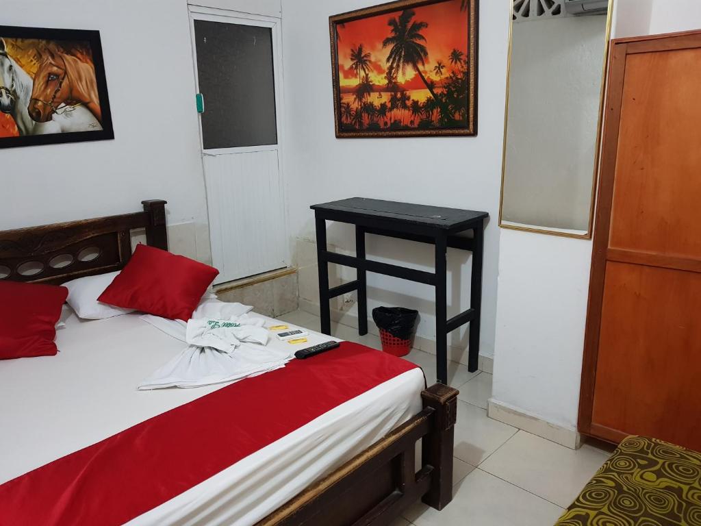 Postel nebo postele na pokoji v ubytování Hostal La Española de Getsemani