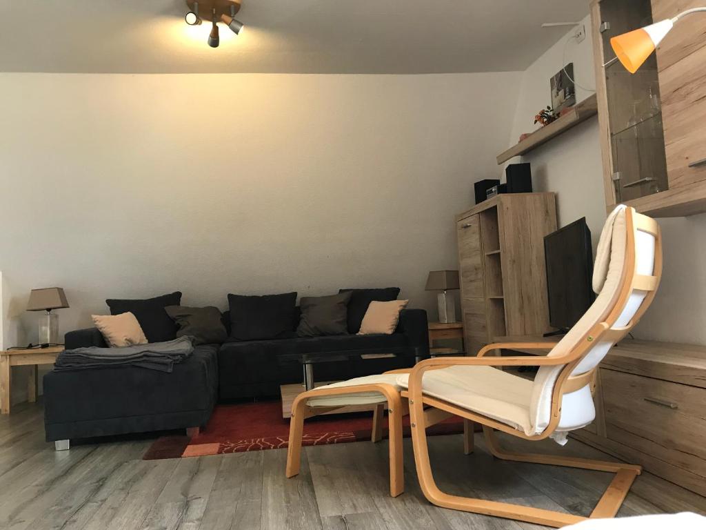 a living room with a couch and a chair at Heaven in Winterberg