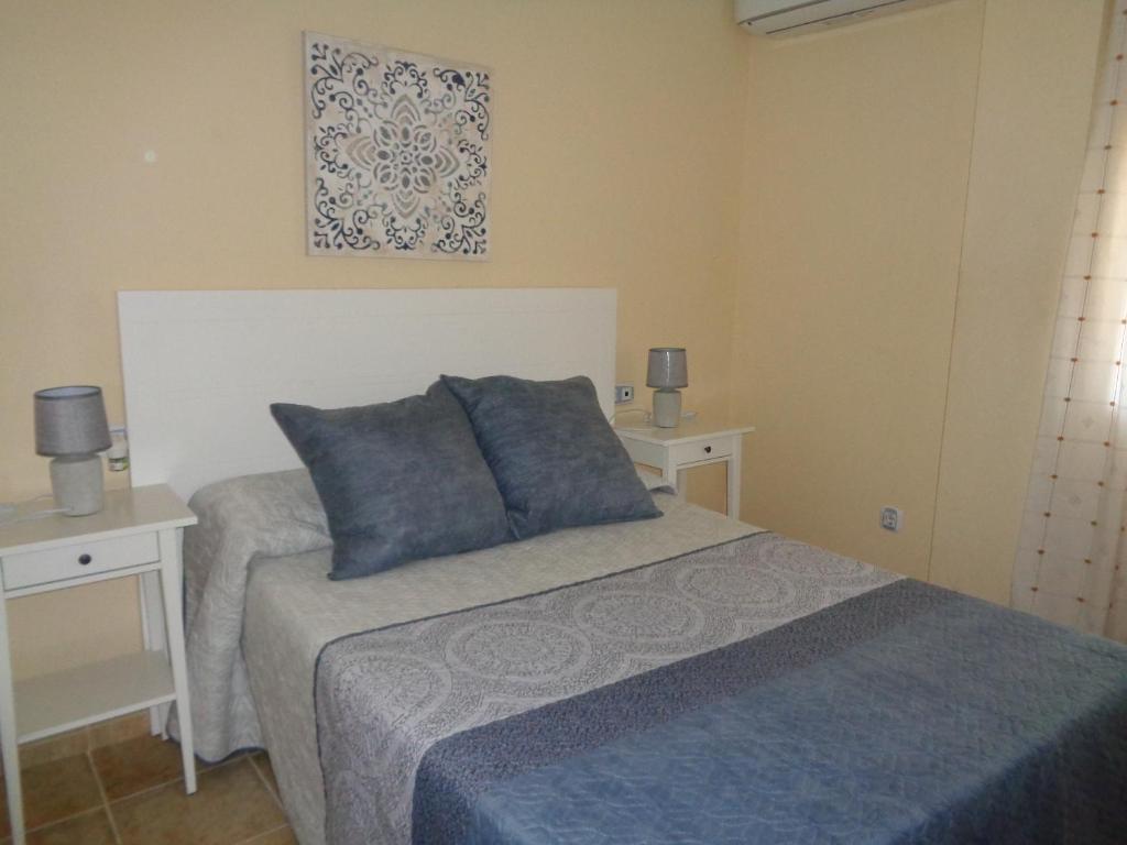 A bed or beds in a room at Apartamento Calle Fundadores
