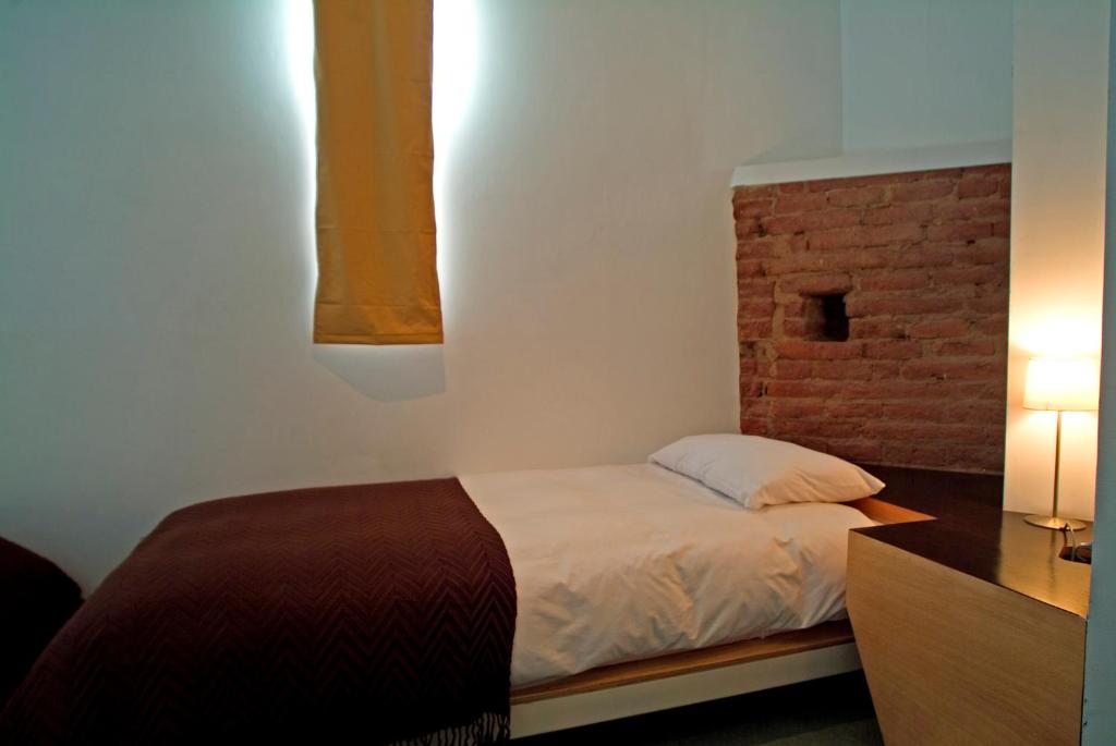 Postel nebo postele na pokoji v ubytování Hotel Latitud 33º Sur
