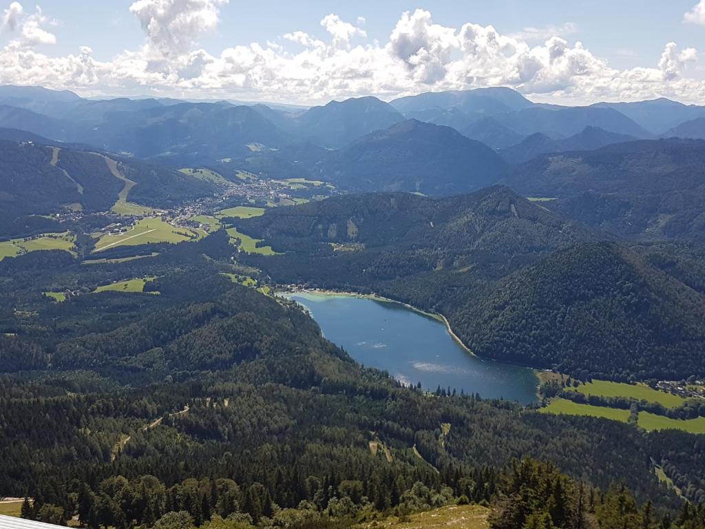an aerial view of a mountain valley with a lake at Apartment Mariazell Bürgeralpe in Mariazell