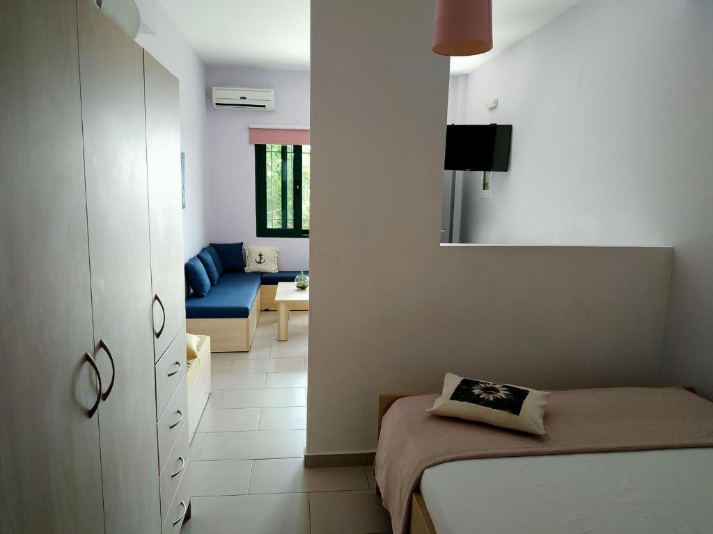 Postel nebo postele na pokoji v ubytování Elina Apartments
