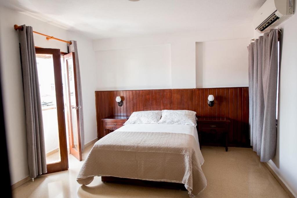 Postel nebo postele na pokoji v ubytování Hotel Acapulco