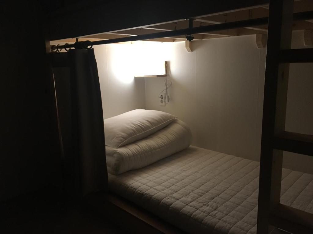 Postel nebo postele na pokoji v ubytování Hwadam Inn