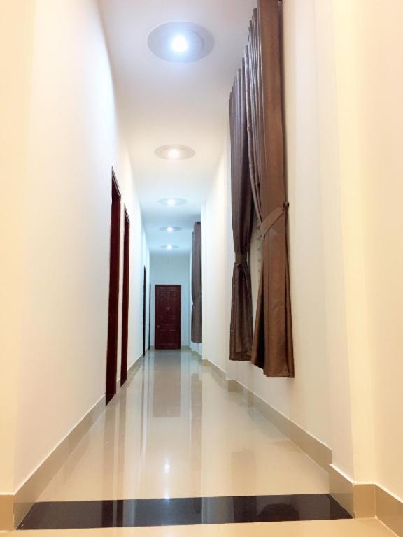 a hallway in a hospital with paintings on the walls at CANH DUONG MOTEL in Lang Co