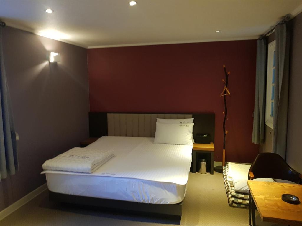 Postel nebo postele na pokoji v ubytování Sunshine Motel