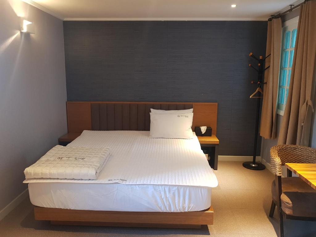 Postel nebo postele na pokoji v ubytování Sunshine Motel