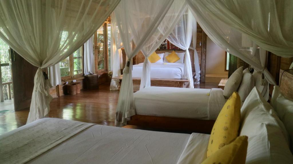 Postel nebo postele na pokoji v ubytování Naya Ubud