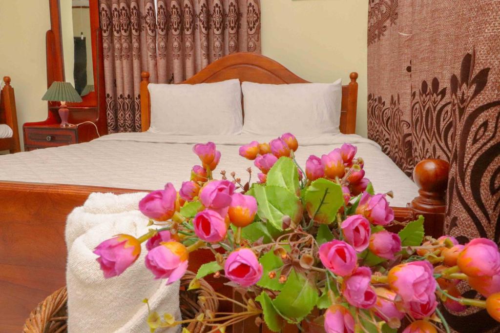 Postel nebo postele na pokoji v ubytování Paradise Cottage