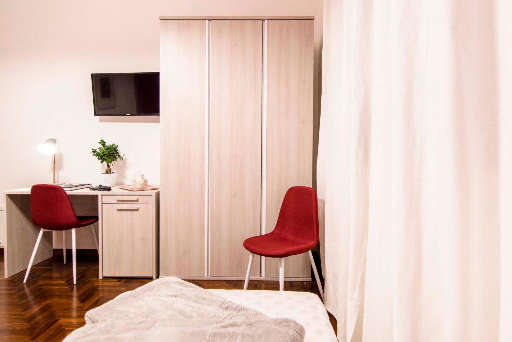 Televízia a/alebo spoločenská miestnosť v ubytovaní Tetide Home