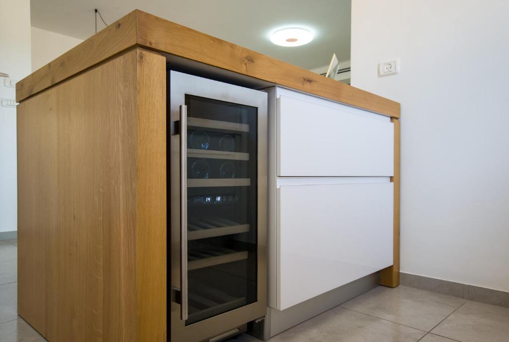 Kuchyň nebo kuchyňský kout v ubytování Maorissimo Boutique Apartment
