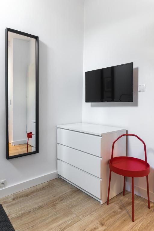 Televízia a/alebo spoločenská miestnosť v ubytovaní 3V Apartments