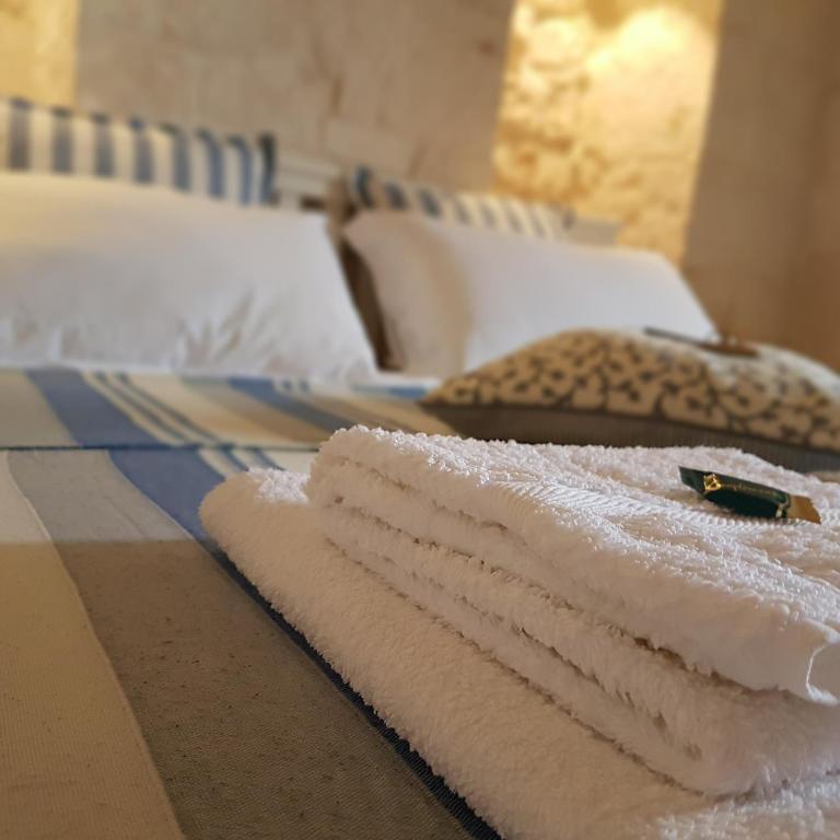 Postel nebo postele na pokoji v ubytování Trulli Petra Chiara