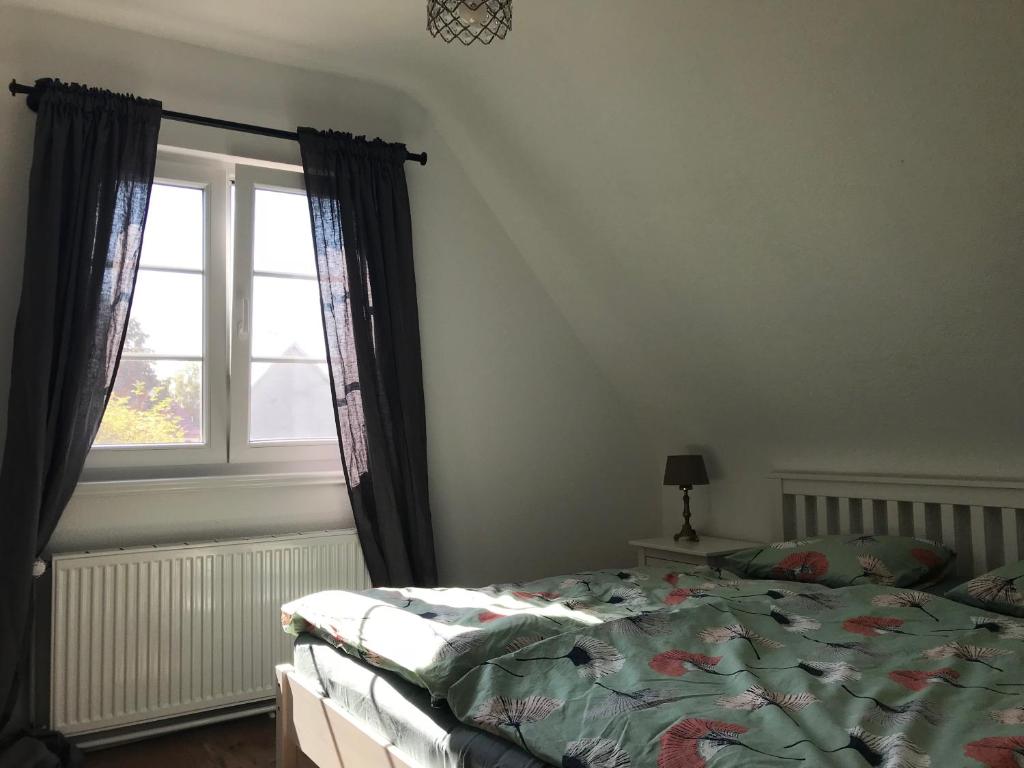 Katil atau katil-katil dalam bilik di Ferienwohnung Haltingen