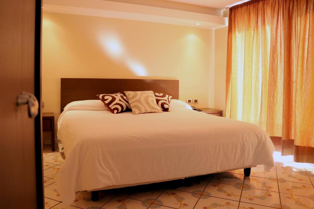 Postel nebo postele na pokoji v ubytování Hotel Ancora