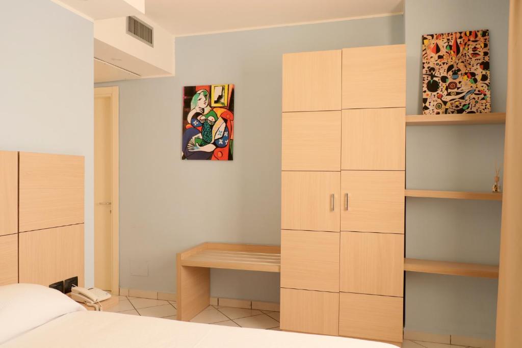 Postel nebo postele na pokoji v ubytování Hotel Ancora